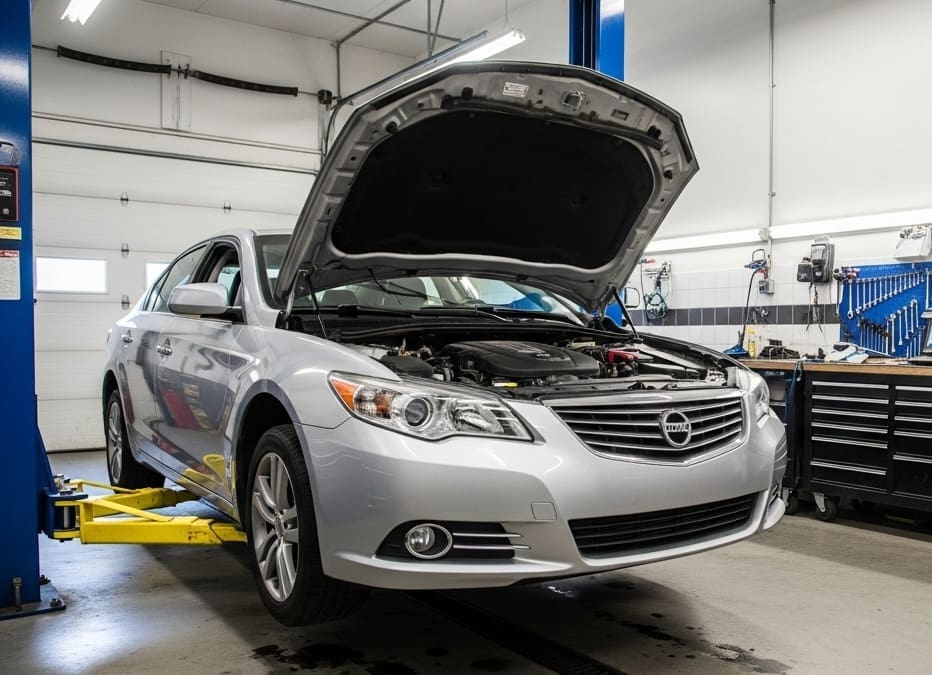 Car on lift with hood open