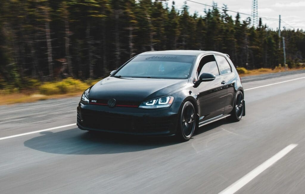 Black car speeding on highway